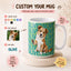 A customized ceramic mug featuring a watercolor illustration of a brown and white dog on a teal background with the word 'OLIVE' repeated. The image is a promotional graphic with instructions on how to customize the mug, including choosing a color, uploading a pet photo, and adding a name, set against a warm beige background.