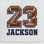 Close-up of personalized football embroidered hat with custom jersey number and player name
